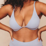 closeup of woman's chest in purple undergarments