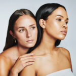 two women looking off to the side